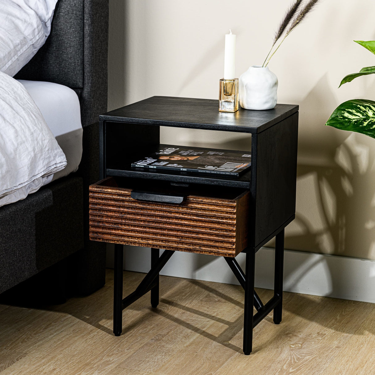 Bedside table Karel DH Interior Black Acacia wood Atmospheric photo diagonal front view