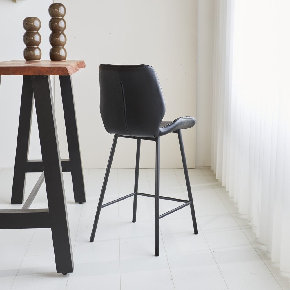 Bar stool Beau artificial leather Dimehouse Black LxWxH 84x54x52 Faux leather Atmospheric photo diagonal rear view