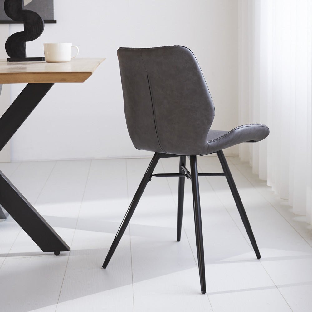 Dining room chair Beau artificial leather Dimehouse Anthracite LxWxH 72x68x50 Faux leather Atmospheric photo diagonal rear view