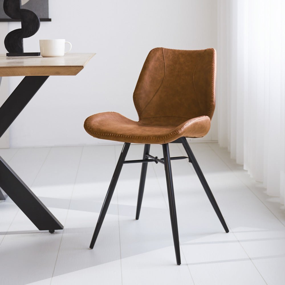 Dining room chair Beau artificial leather Dimehouse Cognac LxWxH 72x68x50 Faux leather Atmospheric photo diagonal front view