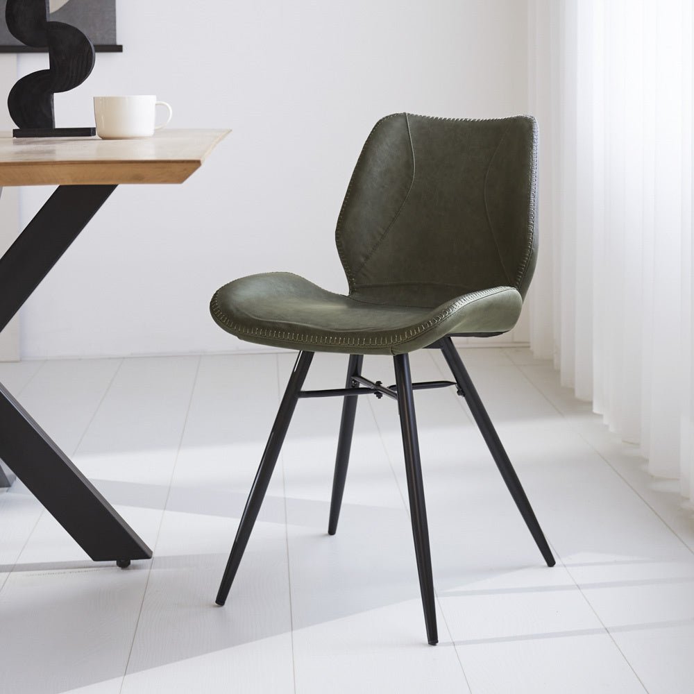 Dining room chair Beau artificial leather Dimehouse Green LxWxH 72x68x50 Faux leather Atmospheric photo diagonal front view