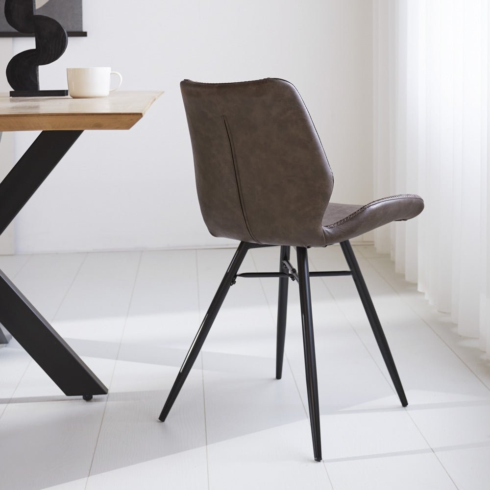 Dining room chair Beau artificial leather Dimehouse Taupe LxWxH 72x68x50 Faux leather Atmospheric photo diagonal rear view