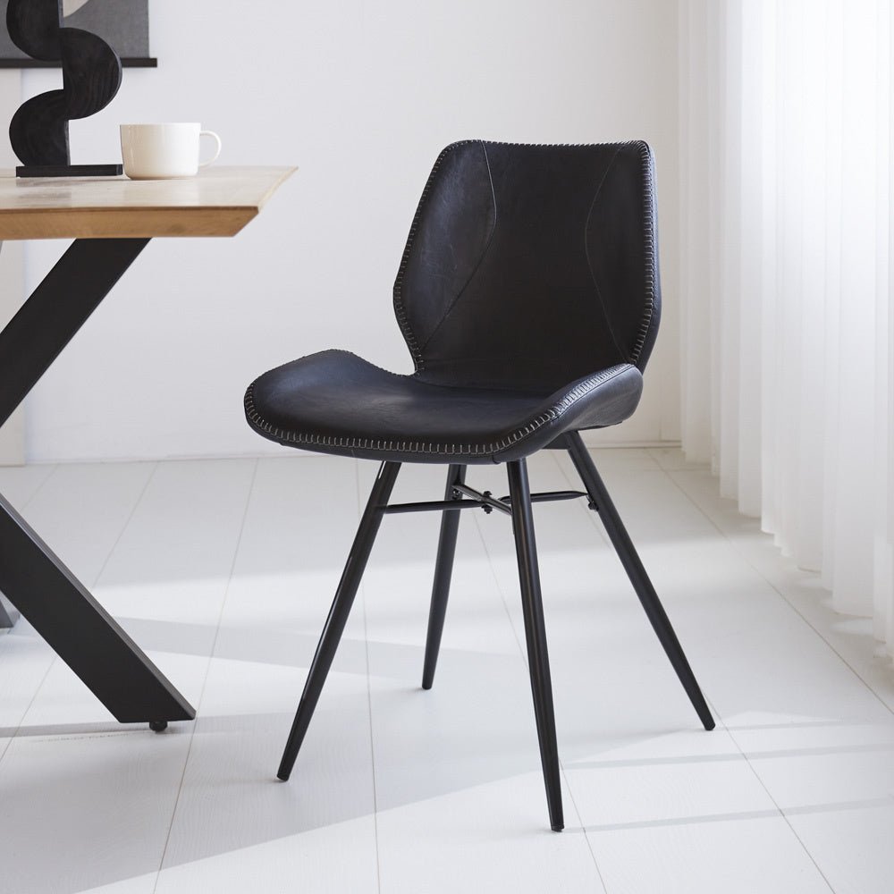 Dining room chair Beau artificial leather Dimehouse Black LxWxH 72x68x50 Faux leather Atmospheric photo diagonal front view