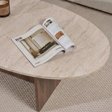 Organic pebble-shaped coffee table with a travertine-look top and walnut melamine base. Japandi design of 120x60cm.