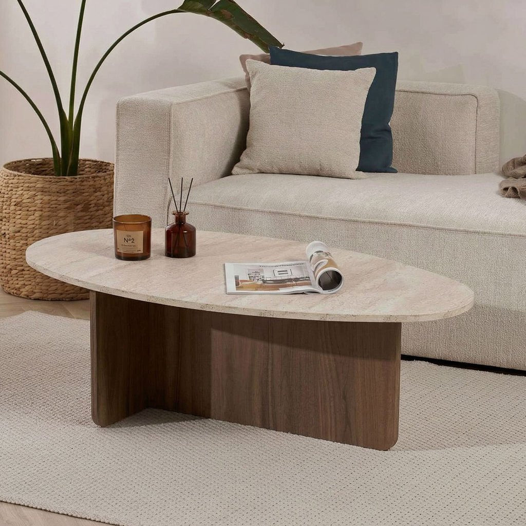 Organic pebble-shaped coffee table with a travertine-look top and walnut melamine base. Japandi design of 120x60cm.