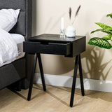 Bedside table Joey DH Interior Black Mango wood Atmospheric photo diagonal front view